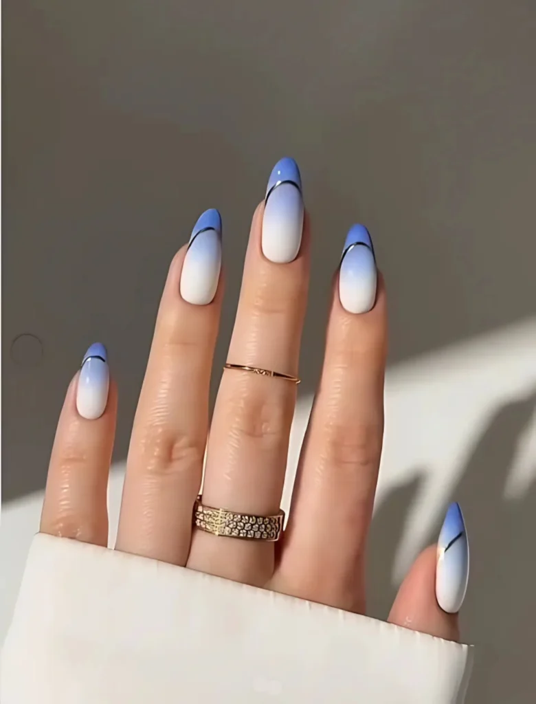 Blue ombre nail art with clean French tips, creating a neat and elegant design. A timeless choice for those who love classic yet modern nail styles